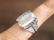 Platinum Moonstone and Baguette Diamond Ring on finger
