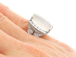 Platinum Moonstone and Baguette Diamond Ring on hand