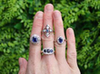 sapphire rings on hand outside