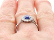 Cushion Cut Sapphire Engagement Ring in Platinum on hand