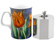 Early 19th Century Silver Tea Caddy next to a mug