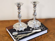 silver candlesticks cutters grape shears and cheese scoop