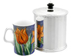 Art Deco Silver Biscuit Box Tin next to a mug