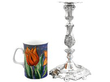 Portuguese Cast Silver Candlestick next to a mug