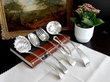 silver flatware items and nut cracker
