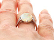1920s White Opal Ring with Diamonds in Platinum on finger