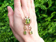 Peridot Necklace Gold in Arts and Crafts Style outside