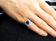 wearing diamond and sapphire ring