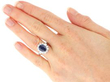 wearing Blue Sapphire and Diamond Platinum Cluster Ring