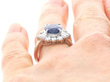 Blue Sapphire and Diamond Platinum Cluster Ring on finger