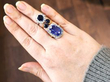 gemstone rings stacked on finger