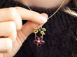 wearing Antique Garnet Pendant with Peridot in Rose Gold