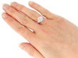 2.5 Carat Diamond Solitaire with Baguettes on hand
