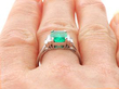 Emerald Ring with Baguette Diamonds in Platinum on finger
