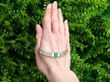 Emerald and Diamond Concave Bar Necklace outside