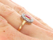 Bezel Set Ruby Cluster Ring in Gold on finger
