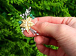 Vintage Emerald and Pearl Flower Brooch outside