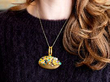 wearing Gemstone Gold Pendant