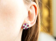 Floral Ruby and Diamond Stud Earring in ear