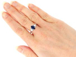 wearing Oval Sapphire & Baguette Cut Diamond Ring