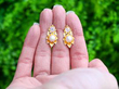 Gold Pearl and Diamond Earrings outside