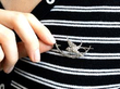 wearing a Victorian swallow brooch
