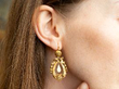 Wearing Antique Pearl Drop Earrings in Gold