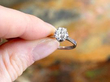 Holding a 1.5 carat Diamond Solitaire Platinum Ring