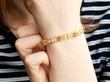 wearing Antique Garnet and Pearl Bracelet in Gold