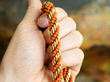 18k Yellow Gold and Coral Rope Necklace in Hand