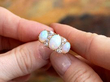 Victorian opal ring being held