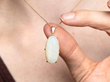 7.34 Carat Cabochon Opal Pendant in Gold wearing