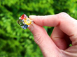 Green Orange and Blue Sapphire Ring in Gold outside
