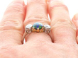 Antique Black Opal and Diamond Trilogy Ring on finger