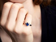 Oval Sapphire Ring with Diamond Shoulders on hand