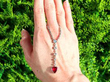 Pear Cut Ruby Pendant Necklace outside