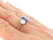 Cushion Cut Sapphire Trilogy Ring in Platinum on hand