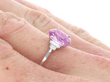 Pink Sapphire Engagement Ring with Baguette Diamonds on hand