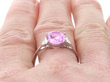 Pink Sapphire Engagement Ring with Baguette Diamonds on finger