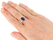 wearing Oval Sapphire Engagement Ring in Platinum
