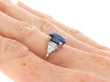 Oval Sapphire Engagement Ring in Platinum on hand