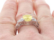 3.9 Carat Oval Yellow Sapphire Engagement Ring on finger
