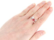 cushion cut ruby twsit ring on hand