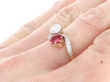 cushion cut ruby twsit ring on finger