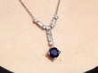 Art Deco Sapphire Pendant in Platinum being worn