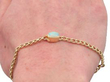 Opal Diamond yellow gold chain bracelet being worn