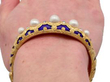 Victorian Pearl and Enamel Bangle  in gold wearing