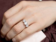 wearing a 3 Carat Three Stone Diamond Ring