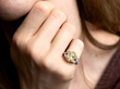 Oval Yellow Diamond Engagement Ring on finger