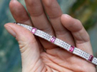 holding a vintage pink tourmaline bracelet